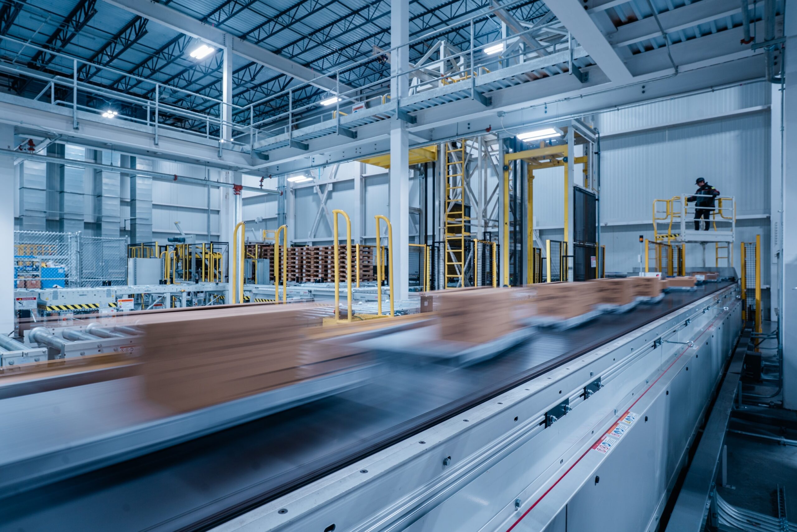 boxes moving quickly on conveyor belt