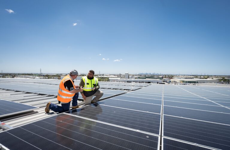 workers on solar panels