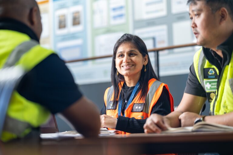 supply chain workers smiling and talking