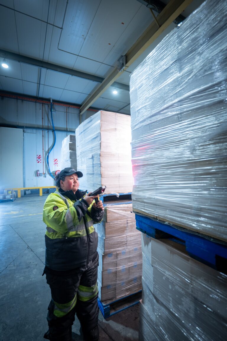 woman scanning boxes
