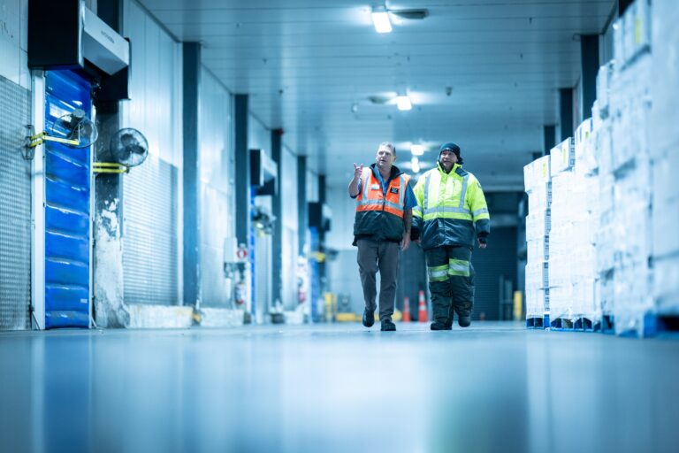 workers walking through facility together