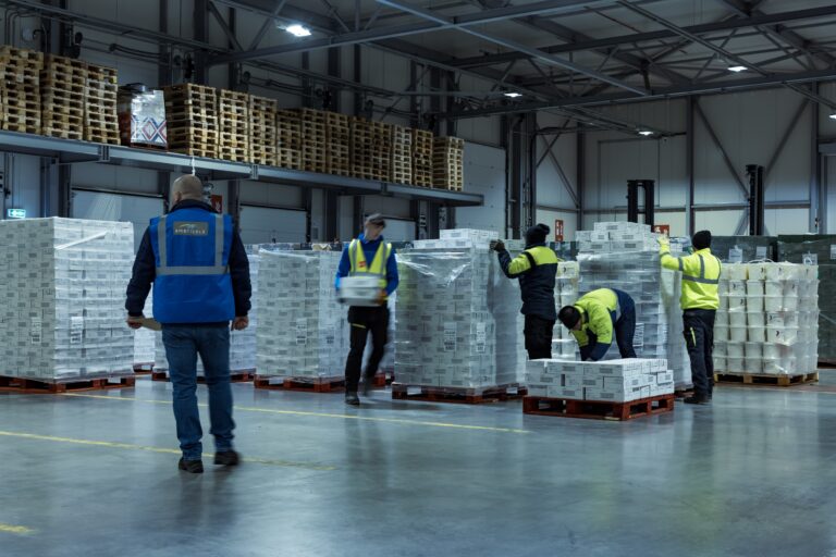 workers loading boxes in facility
