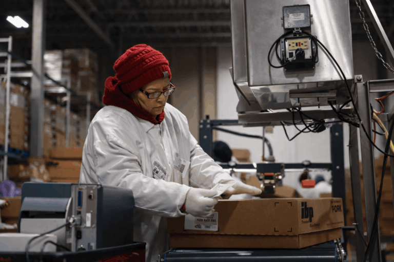 woman labeling packages