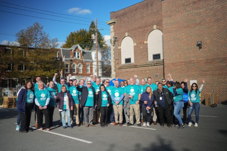 volunteer group smiling together